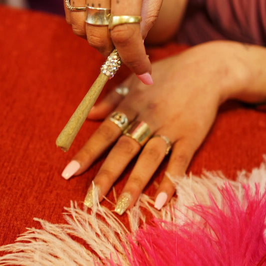 Bedazzled CBD Hemp Joint Flower Rhinestone Dress up Nails Acrylic Black Hands Pink Feathers Rings Gold Sparkles Silver