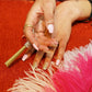 Bedazzled CBD Hemp Joint Flower Rhinestone Dress up Nails Acrylic Black Hands Pink Feathers Rings Gold Sparkles Silver